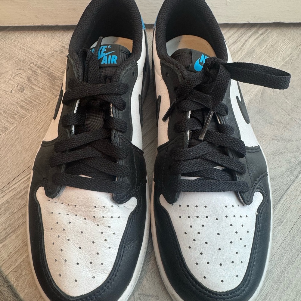 Nike Black & White Low-Top Sneakers with Blue Logo